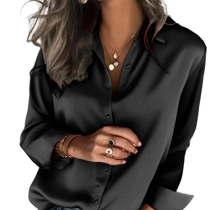 Versatile women's button-down blouse, a relaxed fit top for effortless everyday fashion and elegant styling.