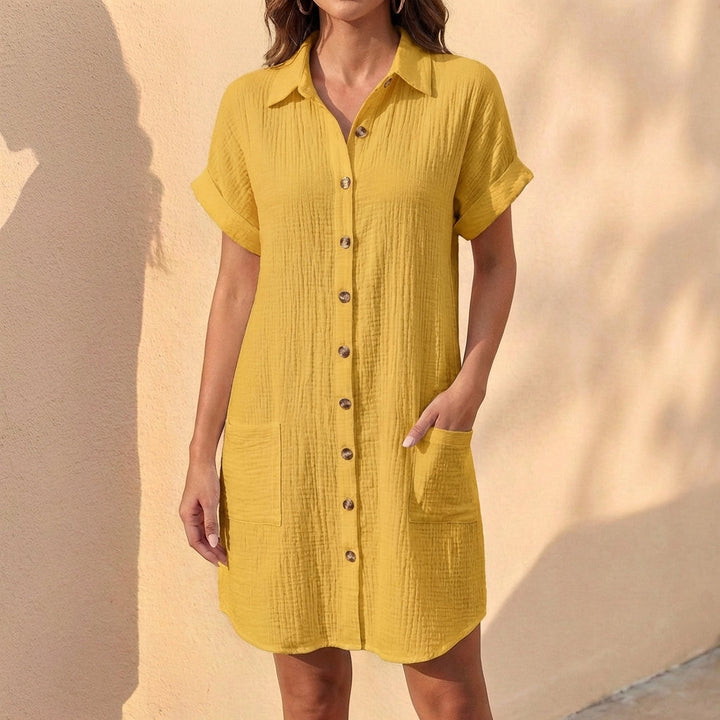Casual women's button front midi shirt dress, ideal for summer daily wear with its relaxed fit and elegant style.
