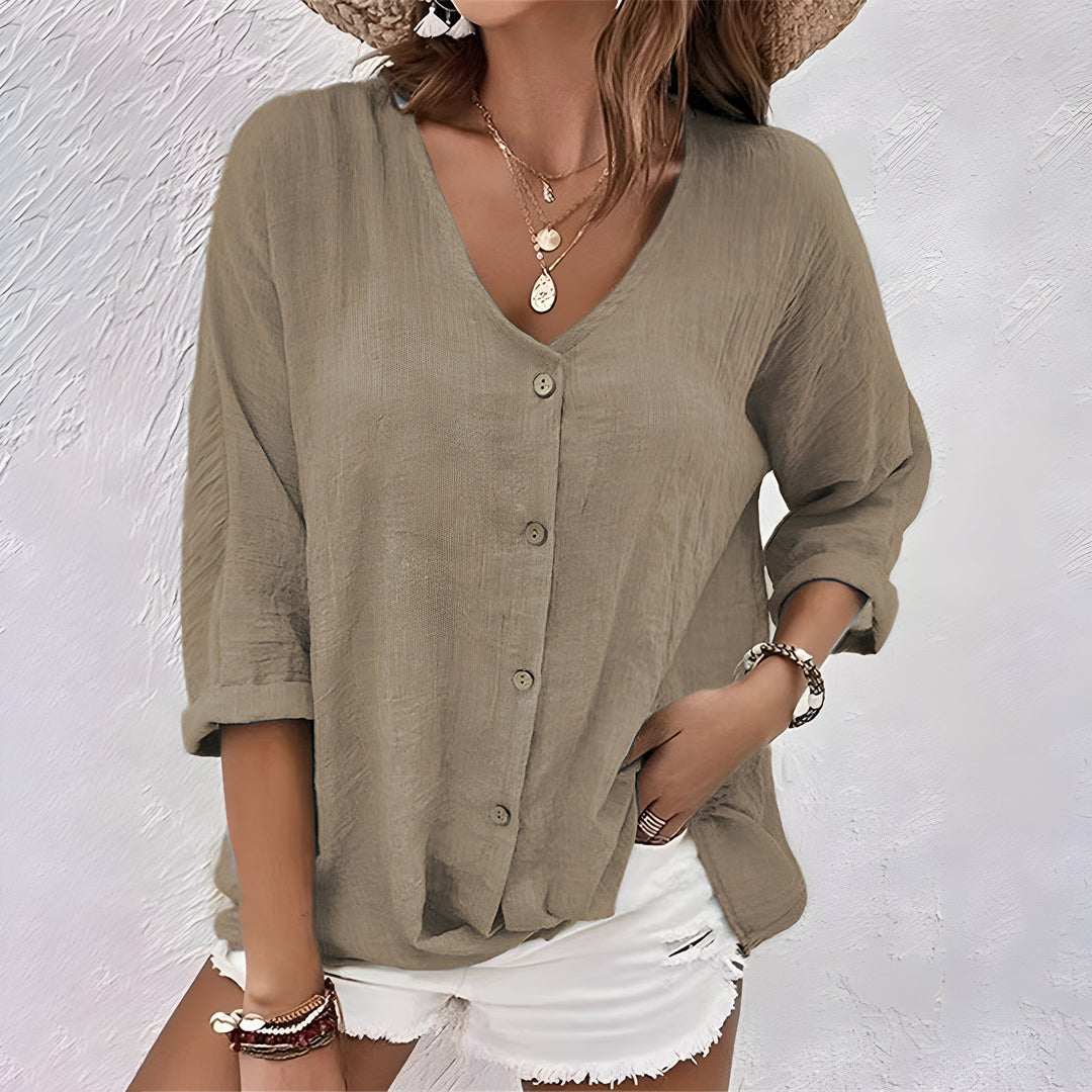 Chic women's relaxed fit button-up blouse, long sleeve, great for casual, office & everyday fashion.