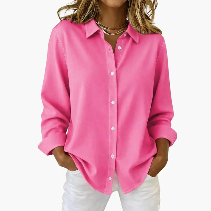 Versatile women's relaxed fit shirt with button-up front and long sleeves.