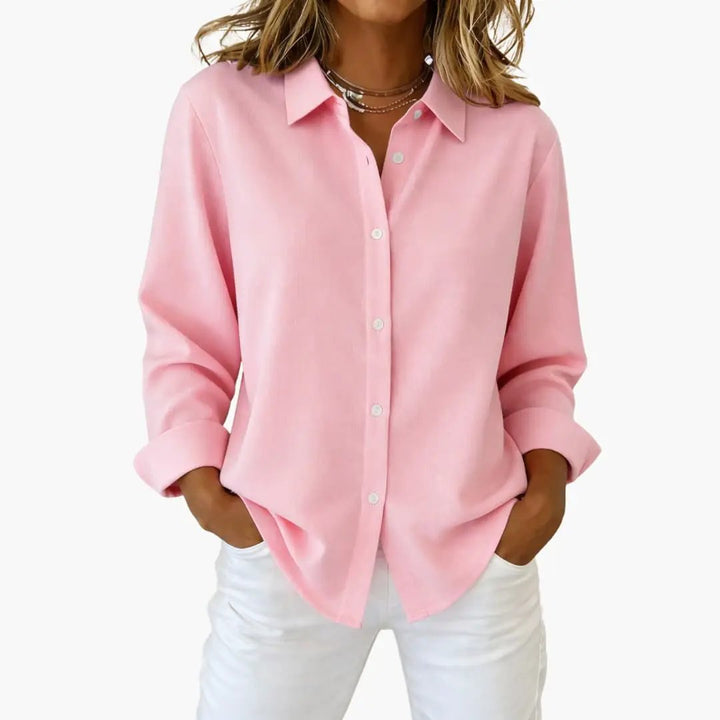 Stylish relaxed fit women's shirt with long sleeves and button-up design.