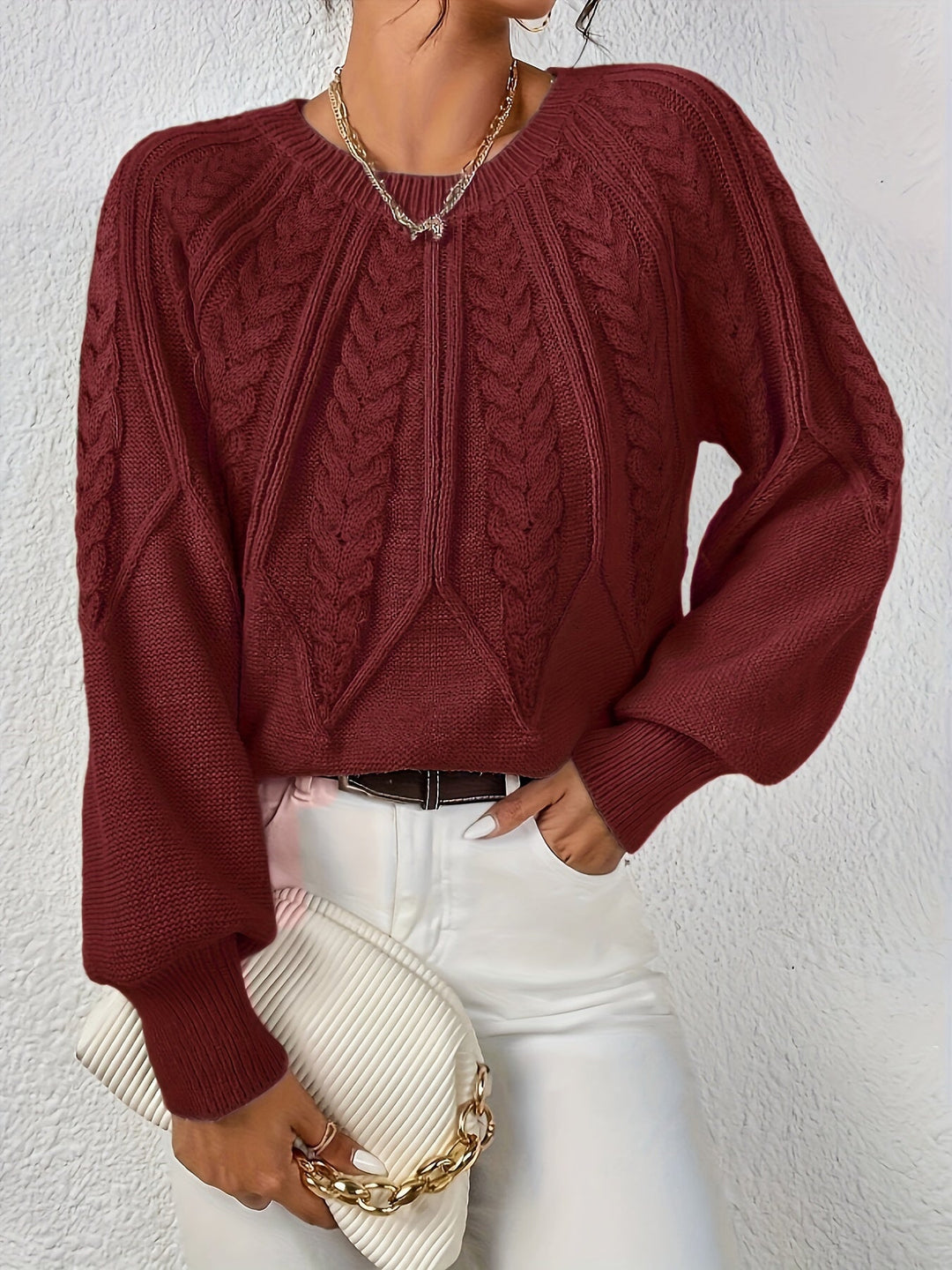 Must-have women's relaxed fit cable knit top, perfect with fashionable lantern sleeves.
