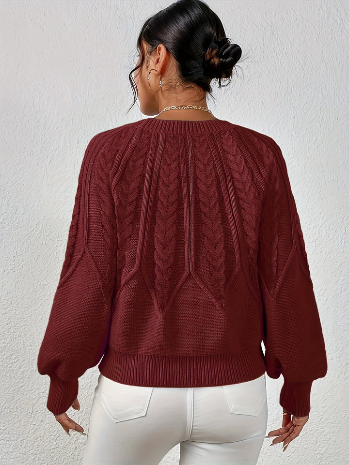 Cozy women's pullover sweater, cable knit design, relaxed fit, and charming lantern sleeves.