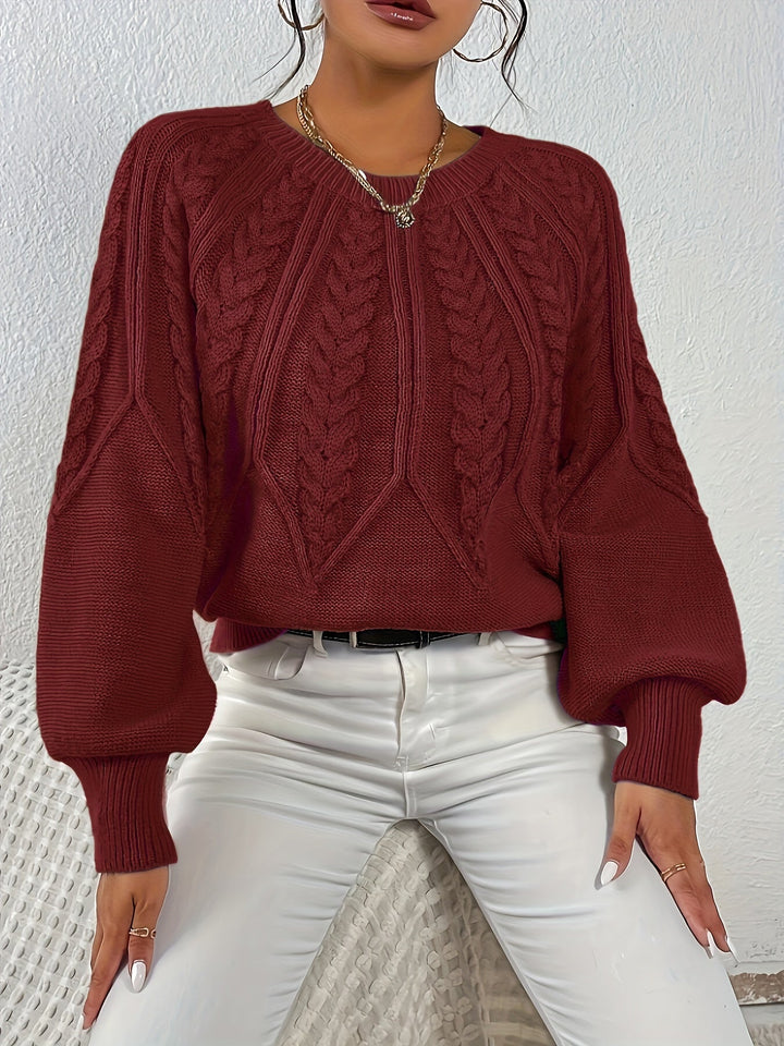 Women's relaxed fit sweater, intricate cable knit pattern and beautiful lantern sleeves.