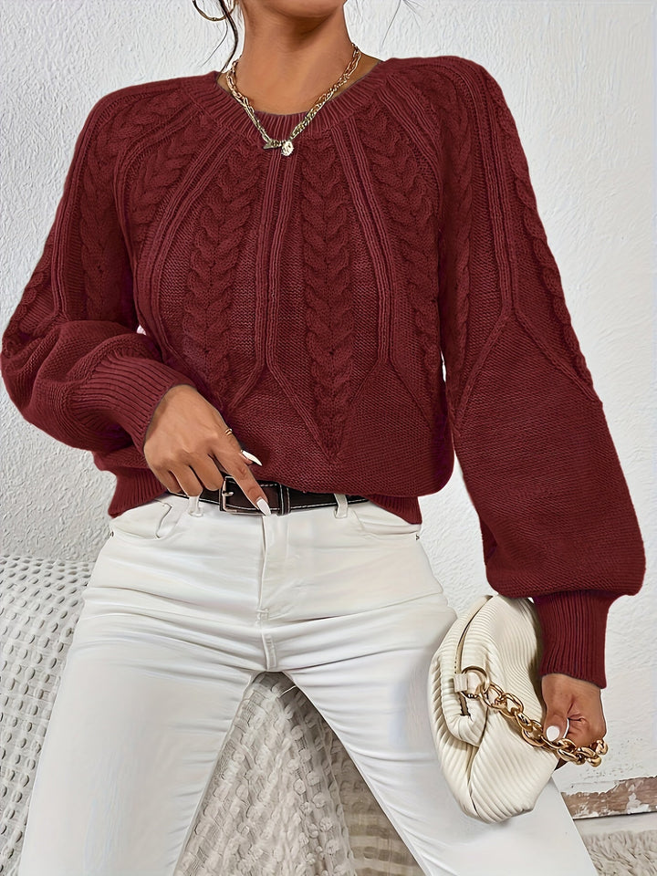 Women's warm winter sweater, comfortable relaxed fit, cable knit, and chic lantern sleeves.