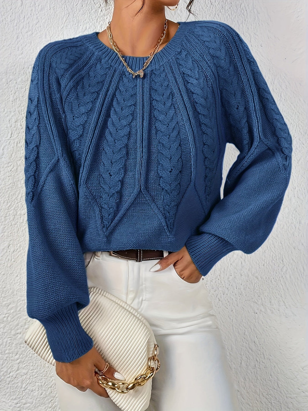 Casual women's long sleeve cable knit sweater, relaxed silhouette with lantern sleeves.