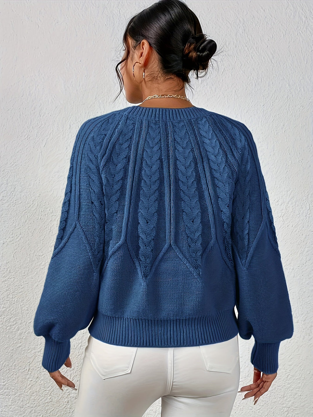 Women's relaxed fit cable knit sweater, ideal for everyday wear, with stylish lantern sleeves.