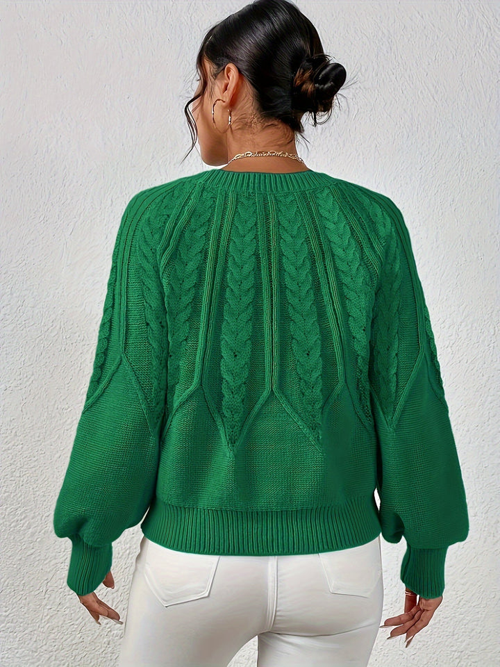 Women's relaxed fit knit sweater, classic cable pattern, and trendy lantern sleeves.