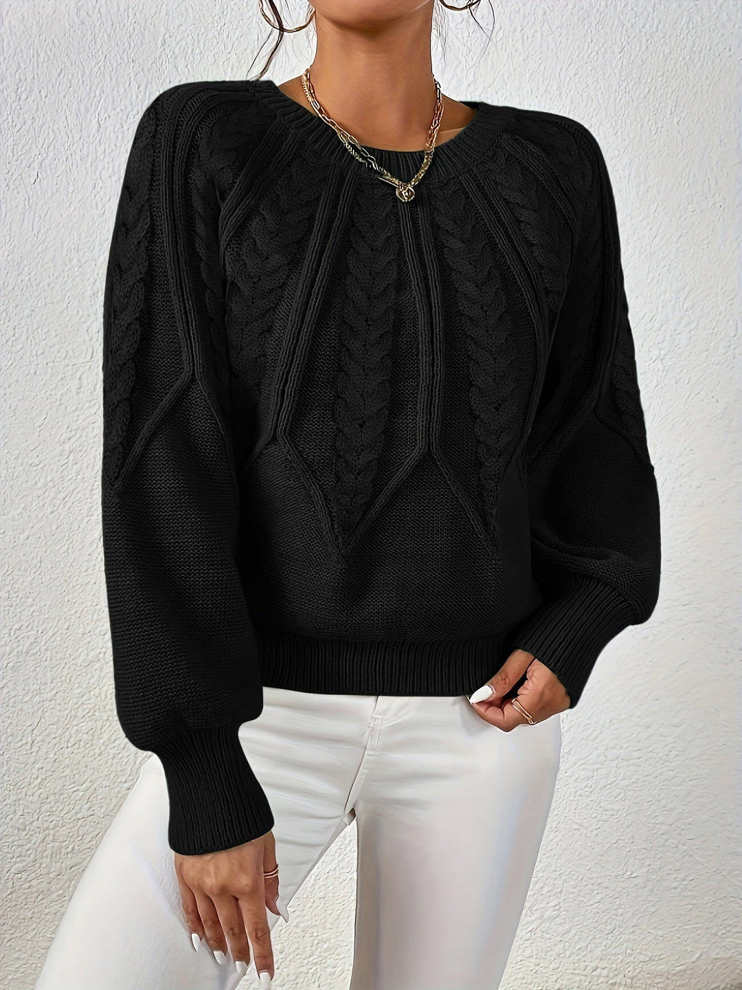Women's fall/winter cable knit sweater, relaxed fit design and fashionable lantern sleeves.