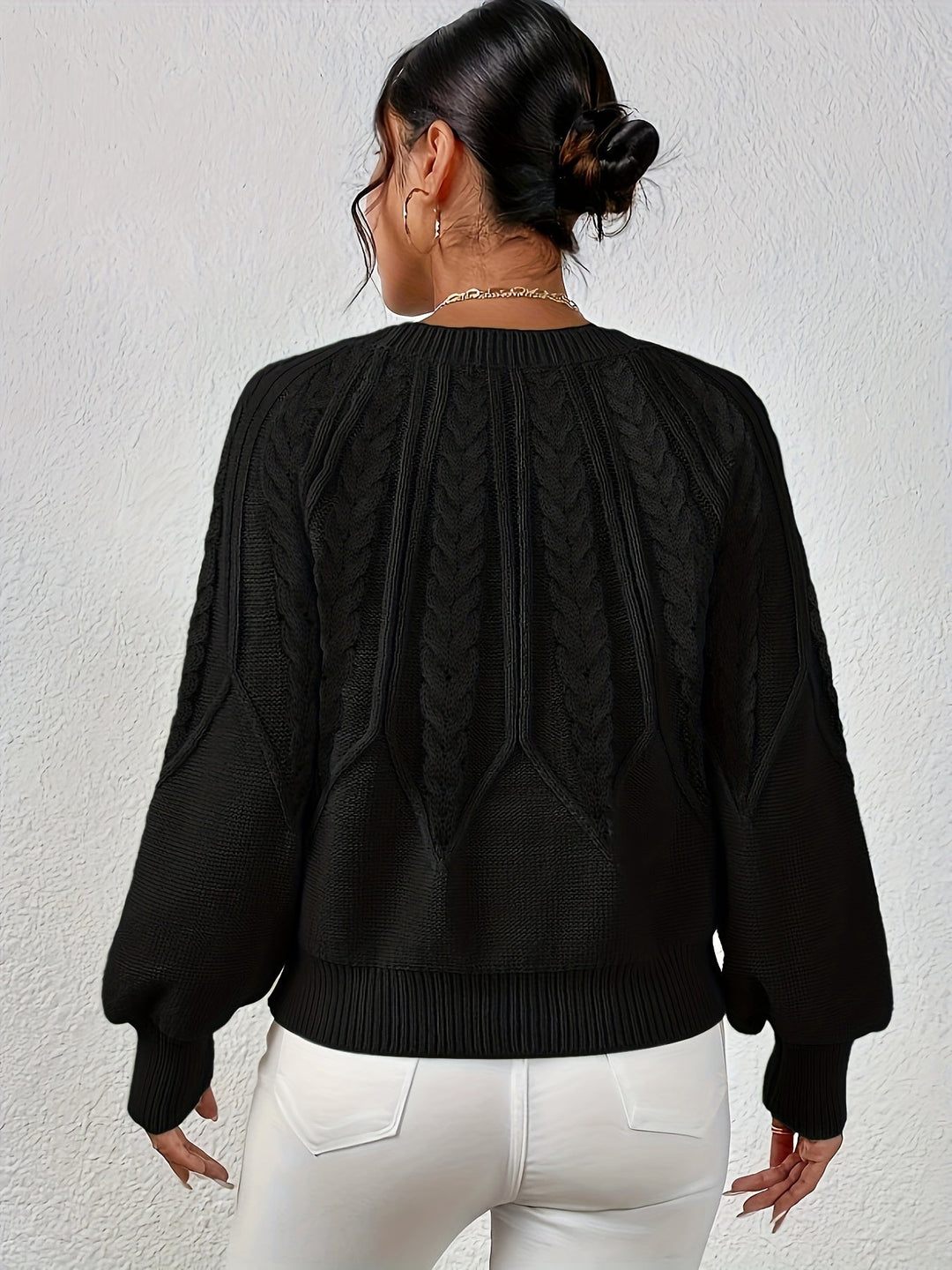 Relaxed fit women's long sleeve sweater, intricate cable knit detail and lantern sleeves.