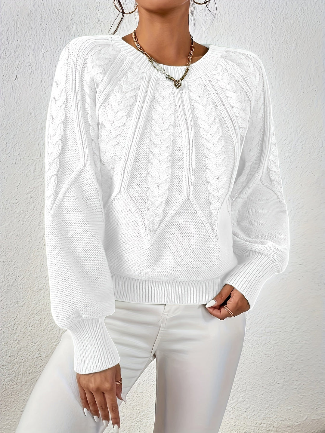 Women's comfortable relaxed fit sweater, cable knit for warmth, with stylish lantern sleeves.