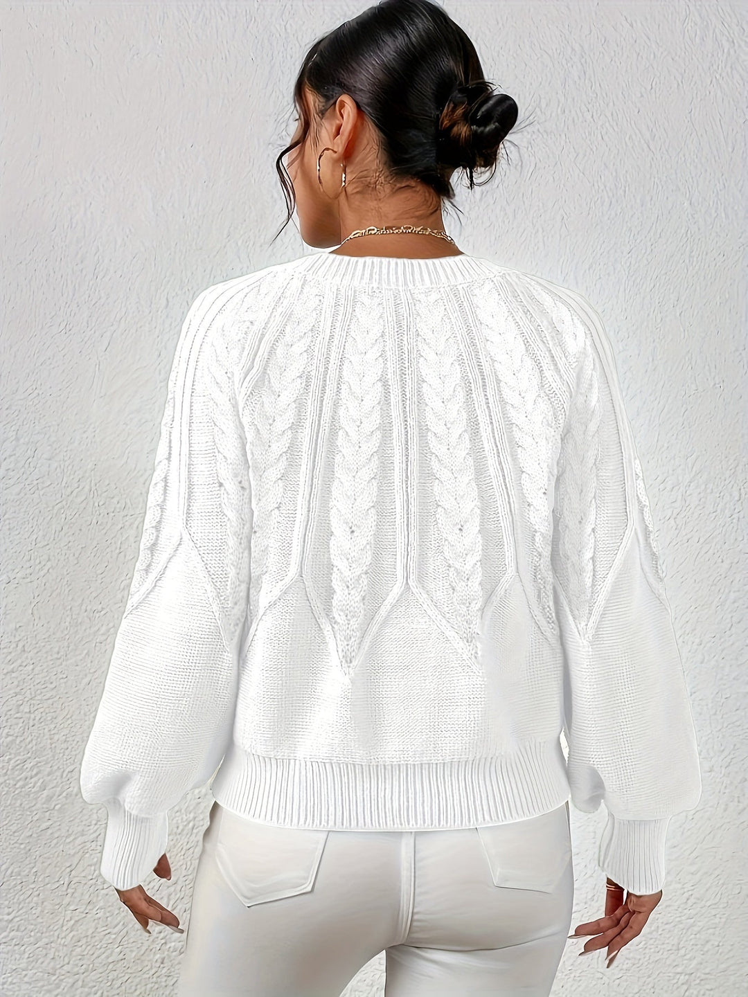 Women's chic cable knit sweater, relaxed fit and elegant lantern sleeves for any occasion.