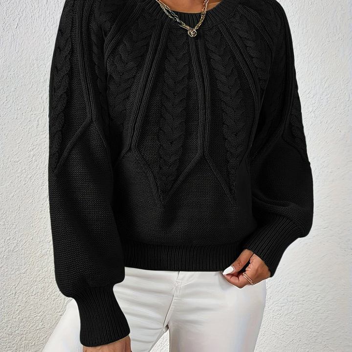 Women's long sleeve cable knit top, relaxed fit for comfort, featuring lantern sleeves.