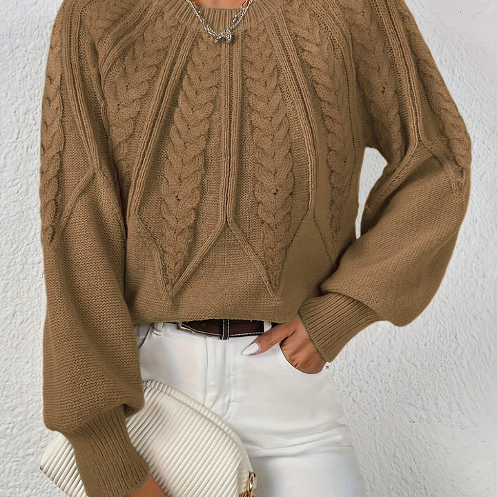 Warm women's cable knit pullover, relaxed fit, ideal for cozy days, with lantern sleeves.
