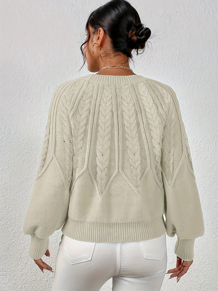 Winter warmth: Women's cozy cable knit sweater, relaxed fit, and stylish lantern sleeves.
