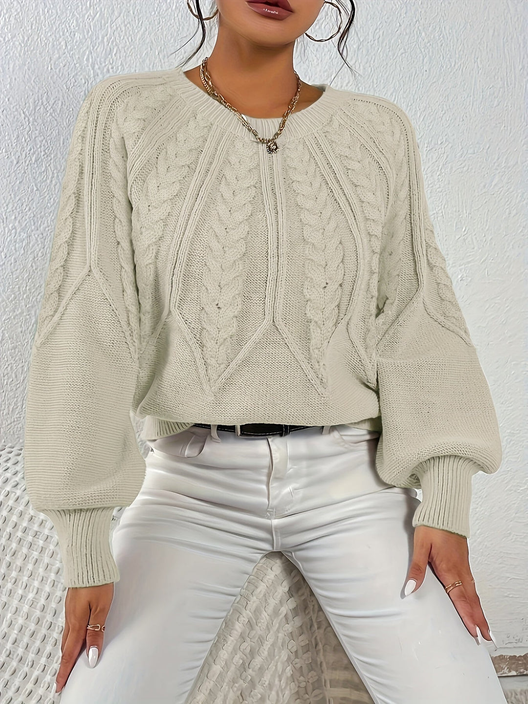 Relaxed fit women's cable knit sweater, comfortable and warm with long lantern sleeves.