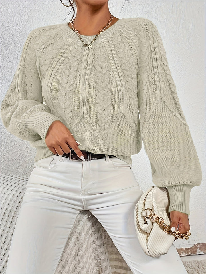 Stylish women's long sleeve cable knit sweater, featuring a relaxed fit and unique lantern sleeves.