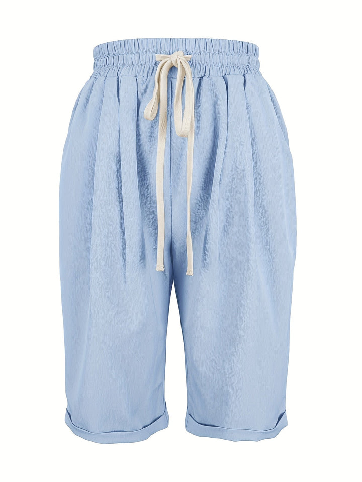 Stylish women's relaxed fit capri trousers featuring a comfortable elastic waist. Great for summer.