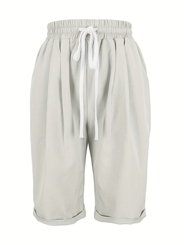 Soft women's relaxed fit capri trousers with elastic waist, offering ultimate comfort for daily wear.