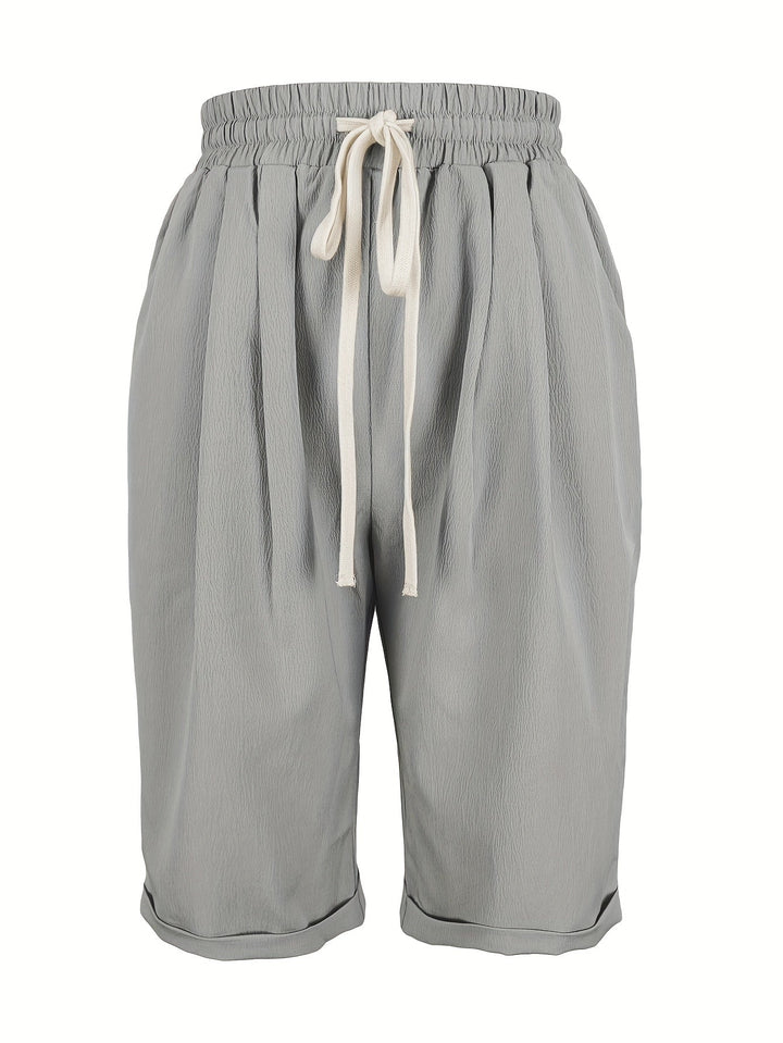 Easy-to-wear women's relaxed fit capri trousers with elastic waist, perfect for summer comfort.