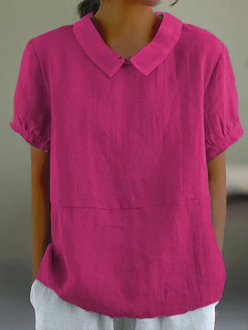 Vintage style women's casual blouse featuring a chic Peter Pan collar & relaxed short sleeve design.