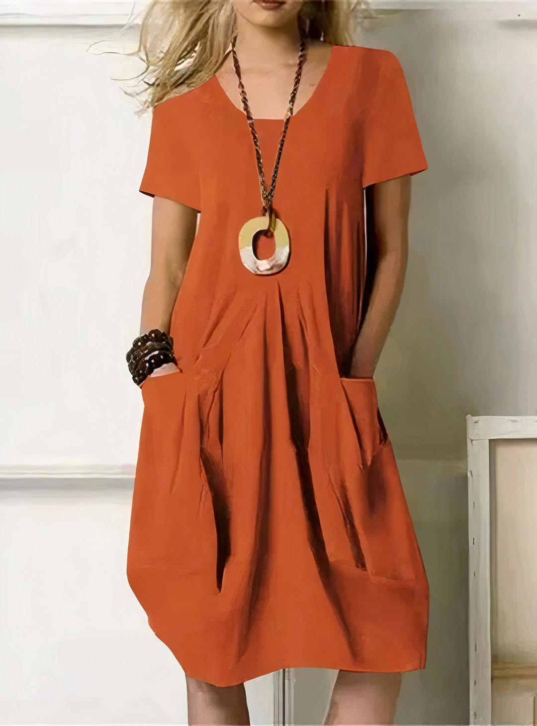 Green women's relaxed fit casual dress. Comfortable & flattering everyday style with pockets.