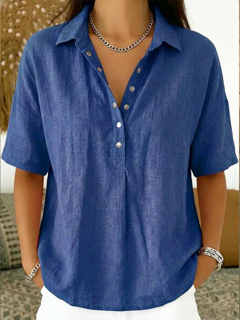 Chic women's relaxed fit button-down collar shirt, versatile for everyday wear. A casual yet stylish spring/summer top.