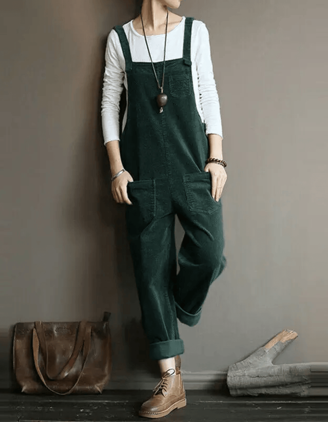 Stylish women's corduroy dungaree jumpsuit. Relaxed fit, wide legs, & functional patch pockets for a vintage look.