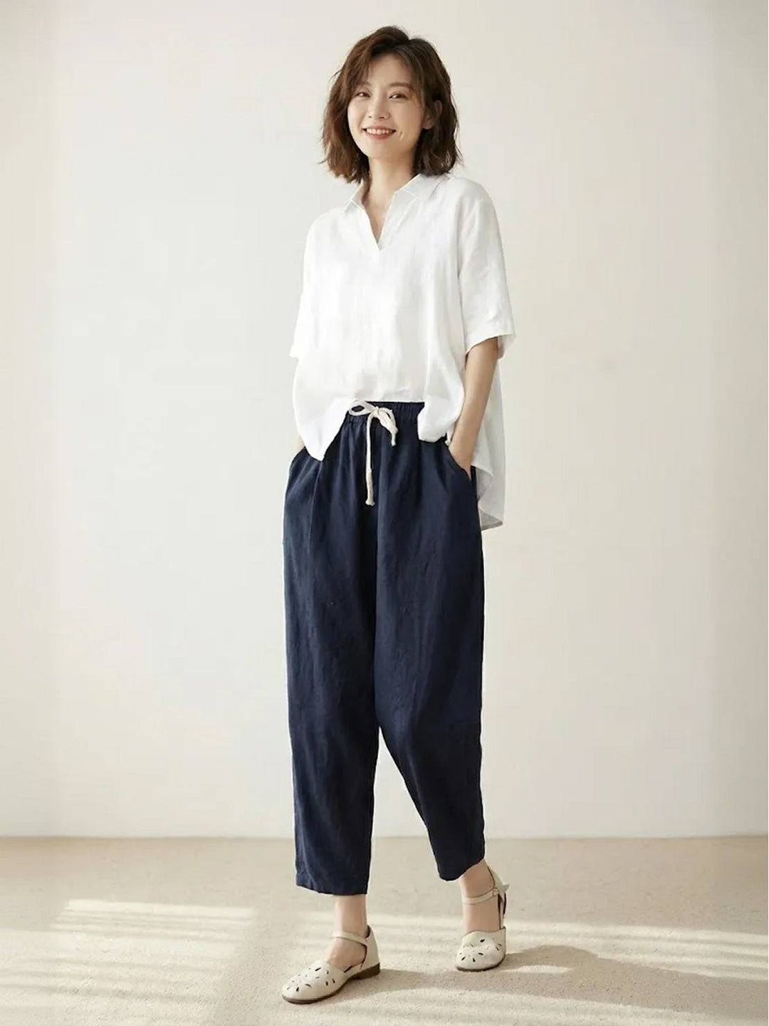 Women's relaxed fit pants with a comfortable elastic waist and cuffed hem.