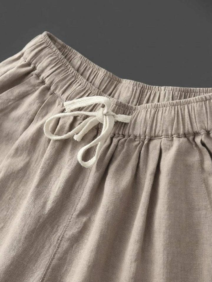 Casual chic women's relaxed fit pants featuring an elastic waist and cuffed hem.