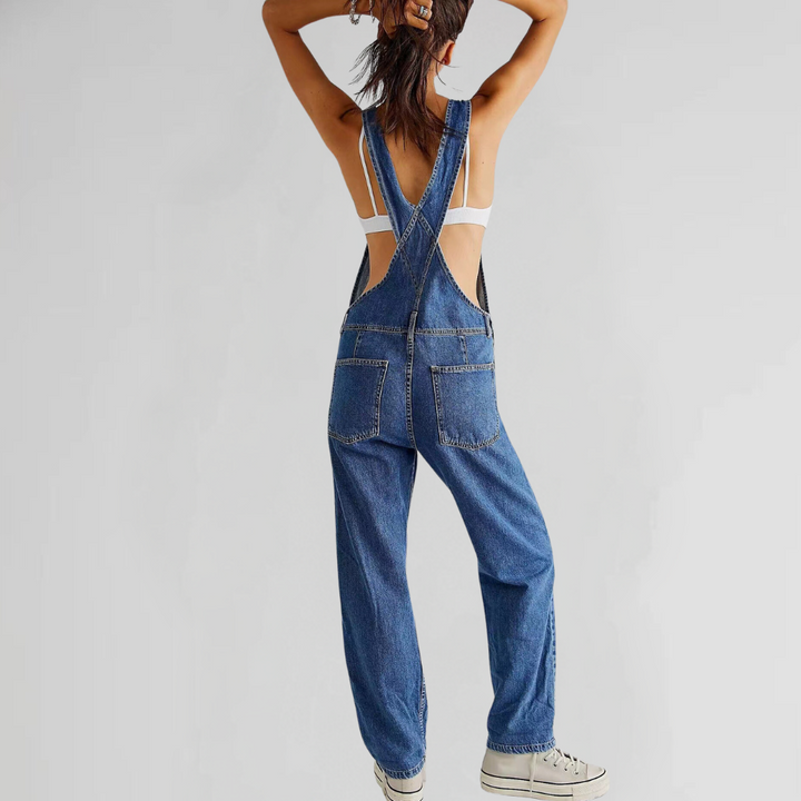 Blue women's relaxed fit overalls, adjustable straps, cuffed hem & pockets. Perfect for versatile casual wear.