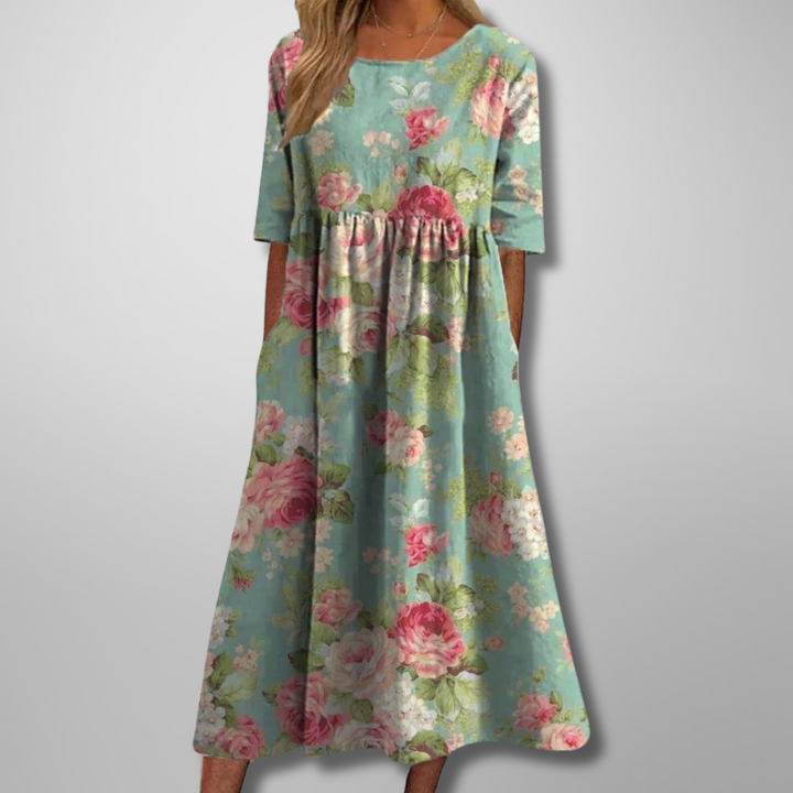 Flowy floral midi dress for women, ideal for casual summer days and relaxed spring fashion.