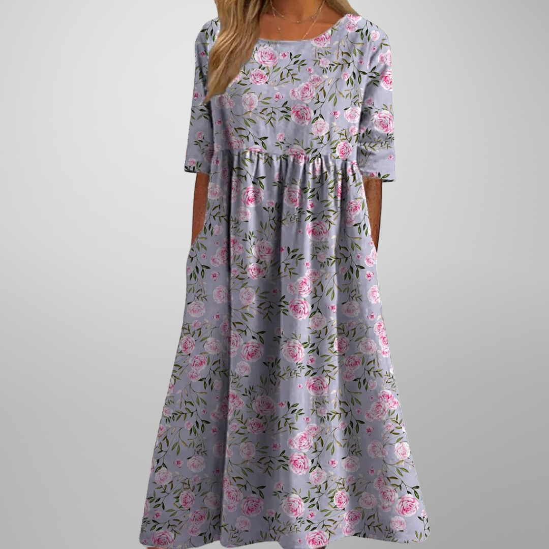 Spring/summer women's floral midi dress, offering a relaxed fit and effortless, flowy style.