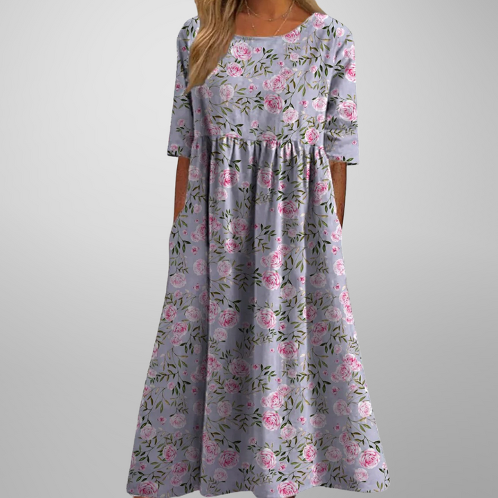 Spring/summer women's floral midi dress, offering a relaxed fit and effortless, flowy style.