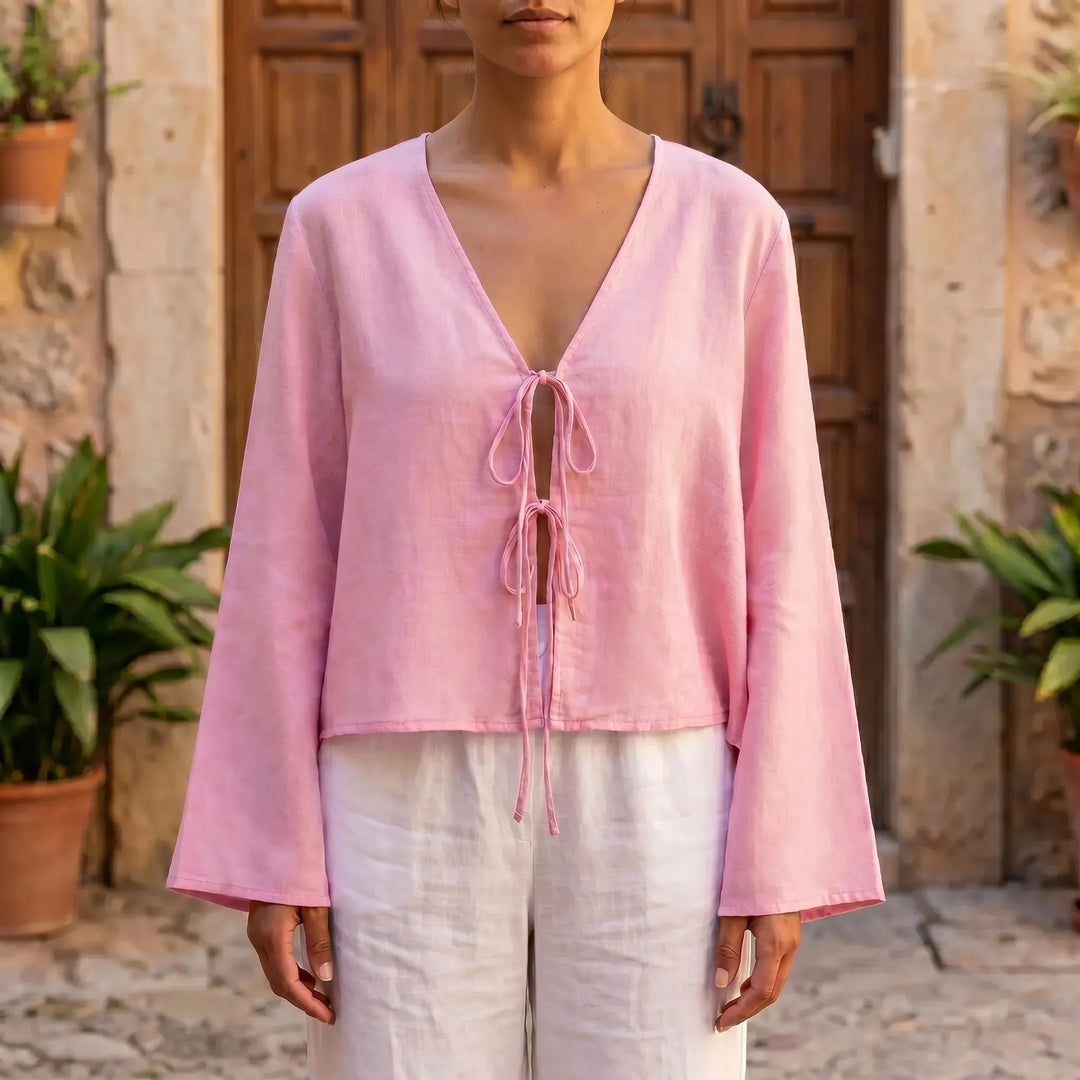 Women's relaxed fit front-tie blouse in pink, perfect for casual summer fashion or warm weather wear.
