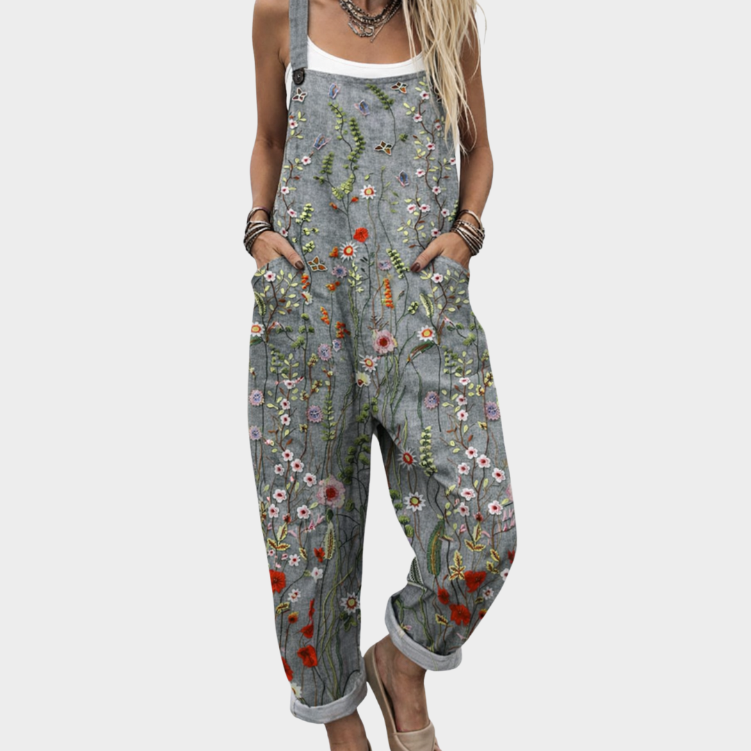 Women's relaxed fit grey wildflower print dungaree jumpsuit, perfect for summer casual wear or a boho festival outfit.