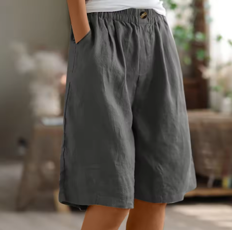 Stylish high-waisted women's Bermuda shorts with a relaxed fit. Comfortable elastic waist for summer casual fashion.