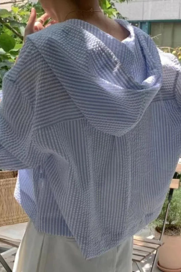 Stylish women's hooded blouse, relaxed fit long sleeve top for versatile everyday fashion & casual summer style.