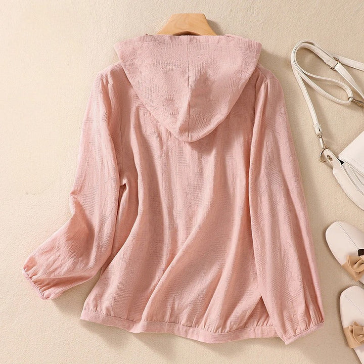 Long sleeve hooded shirt for women, relaxed fit. Ideal light coverage for spring & summer layering.