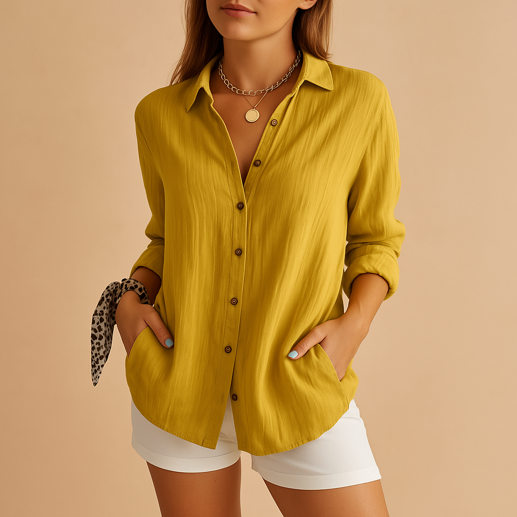 Front view of a women's relaxed fit long sleeve button-up blouse with classic collar.