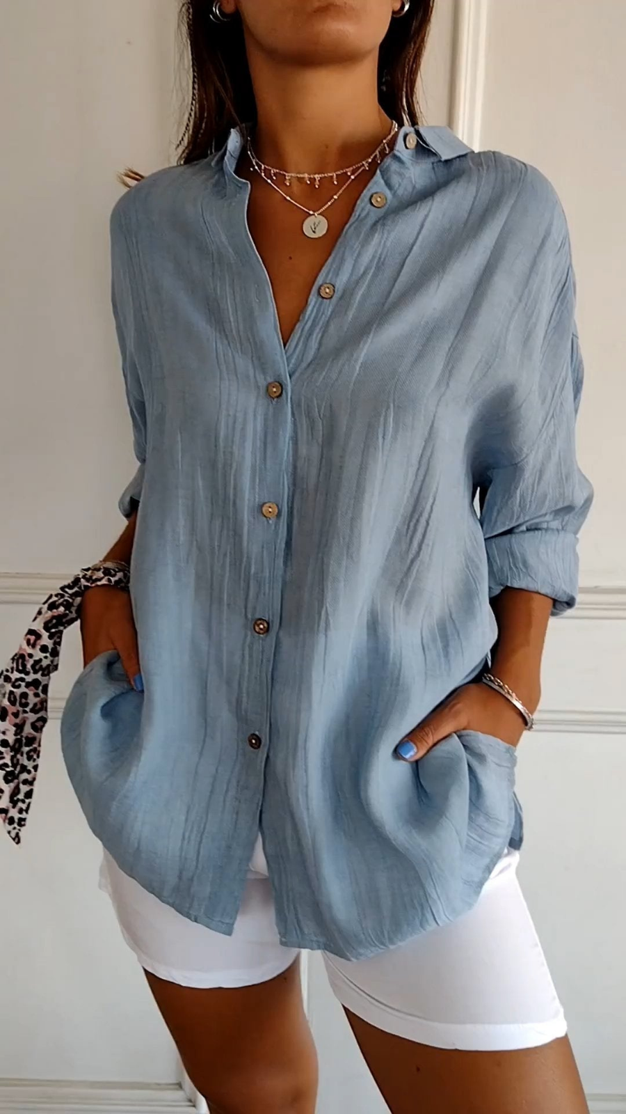 Women's relaxed fit long sleeve button-up shirt, oversized for casual, everyday wear.