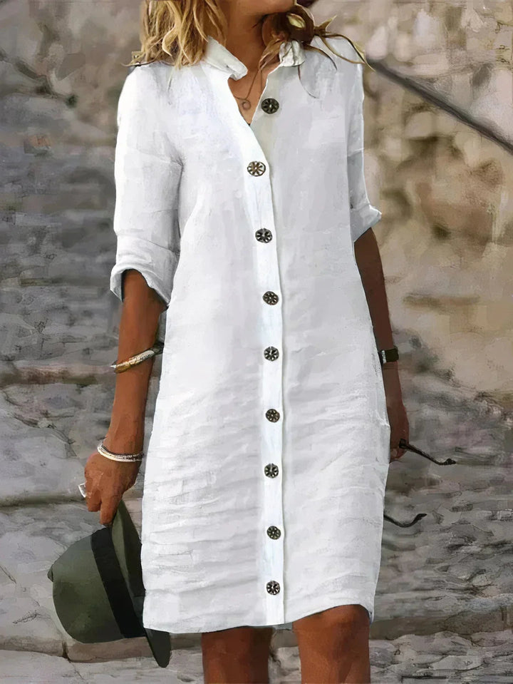 Versatile women's button-up midi dress with three-quarter sleeves. Great for casual day outfits or vacations.
