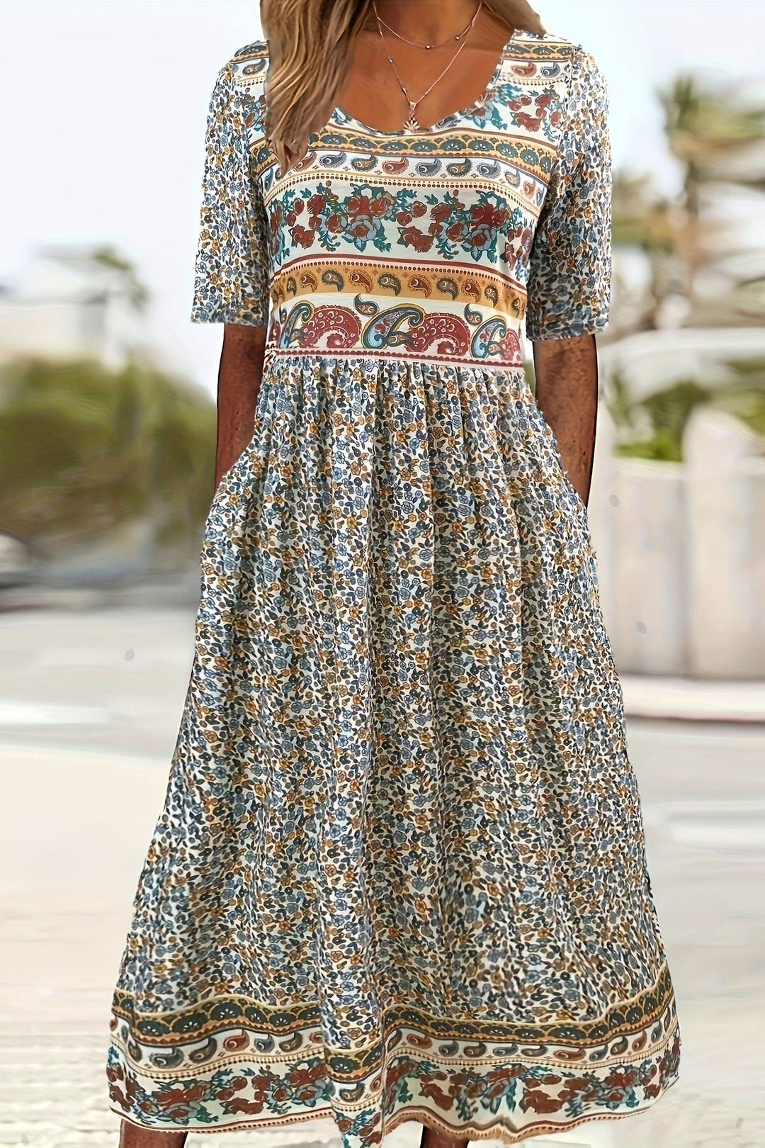 Women's relaxed fit midi dress with vibrant daisy print, ideal for summer casual and comfortable everyday wear.