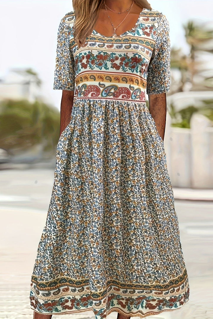 Women's relaxed fit midi dress with vibrant daisy print, ideal for summer casual and comfortable everyday wear.