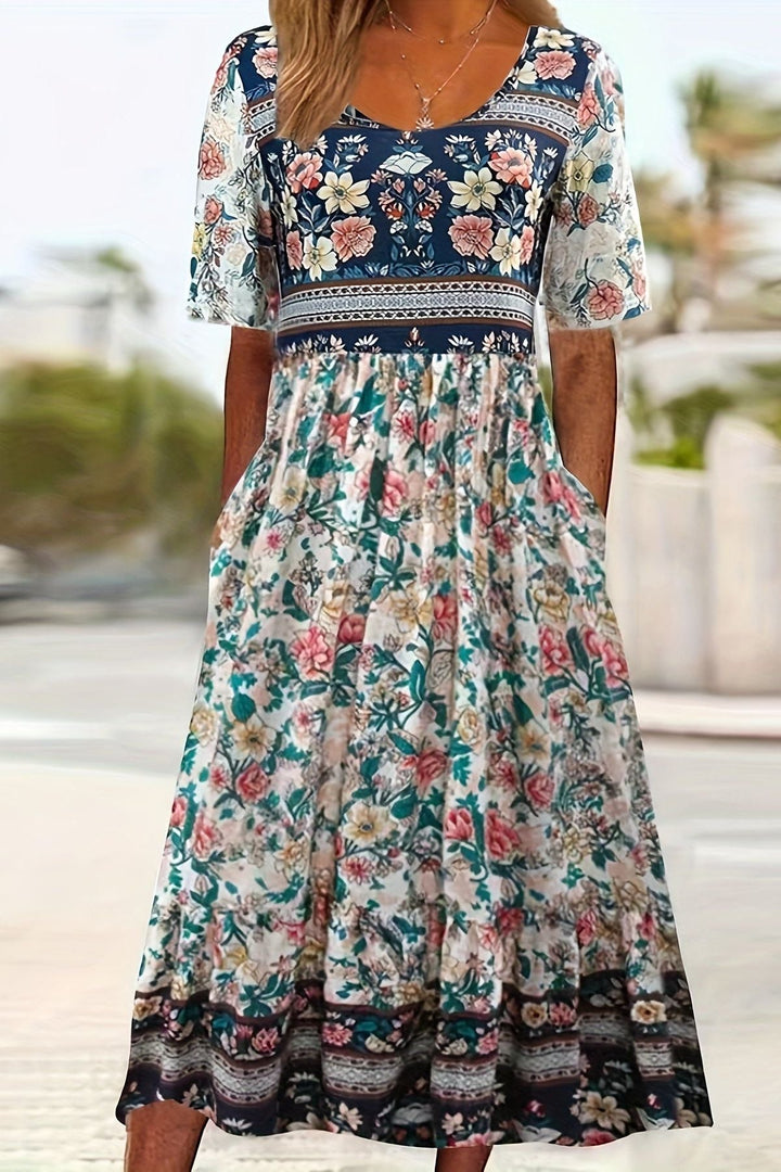 Casual women's summer midi dress, relaxed fit, featuring a charming daisy print for effortless and comfortable styling.