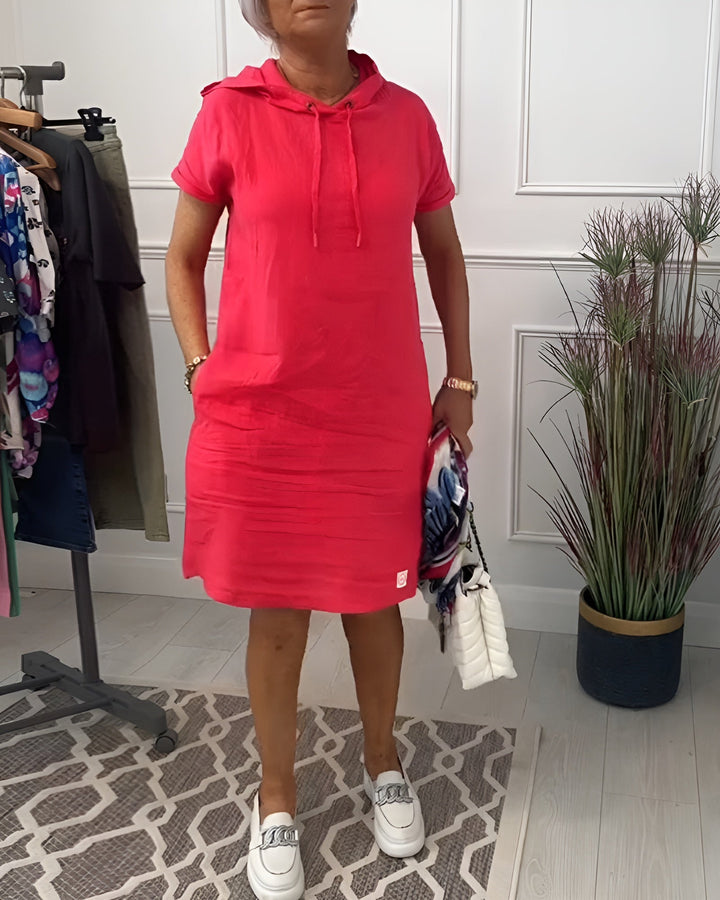 Women's relaxed fit midi hoodie dress with adjustable hood, perfect for casual everyday wear.