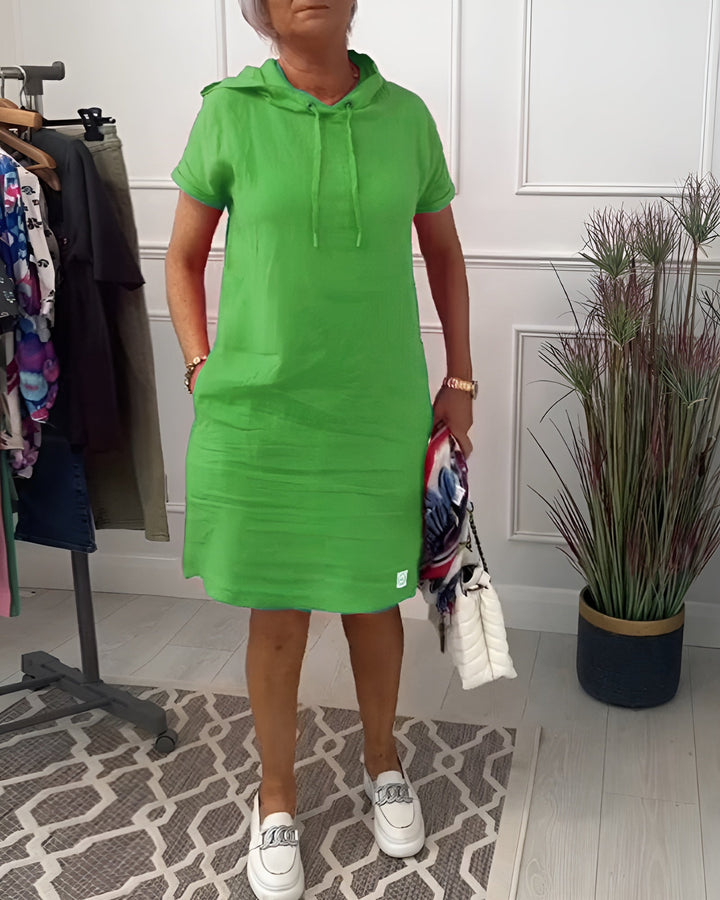 Stylish women's relaxed fit hoodie dress in a versatile midi length, great for casual wear.