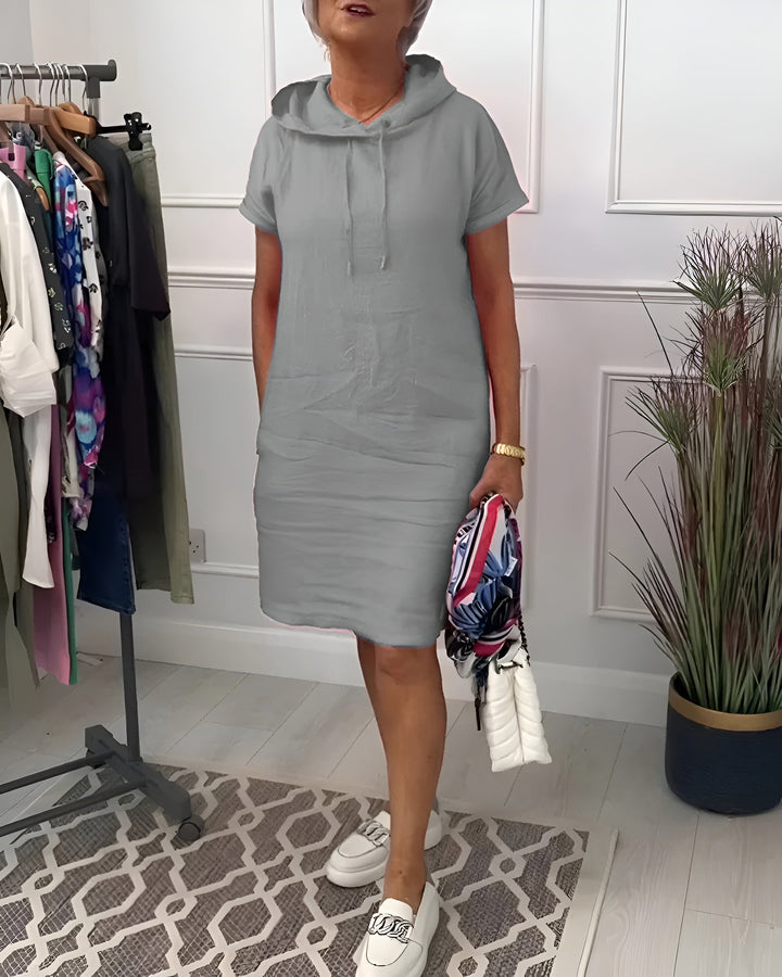 Women's summer relaxed fit hoodie dress, a versatile midi with half sleeves and adjustable hood.