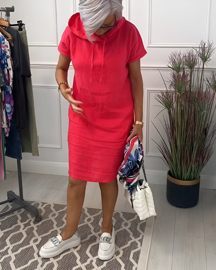 Stylish women's relaxed fit midi dress with an adjustable hood, ideal for casual outfits.