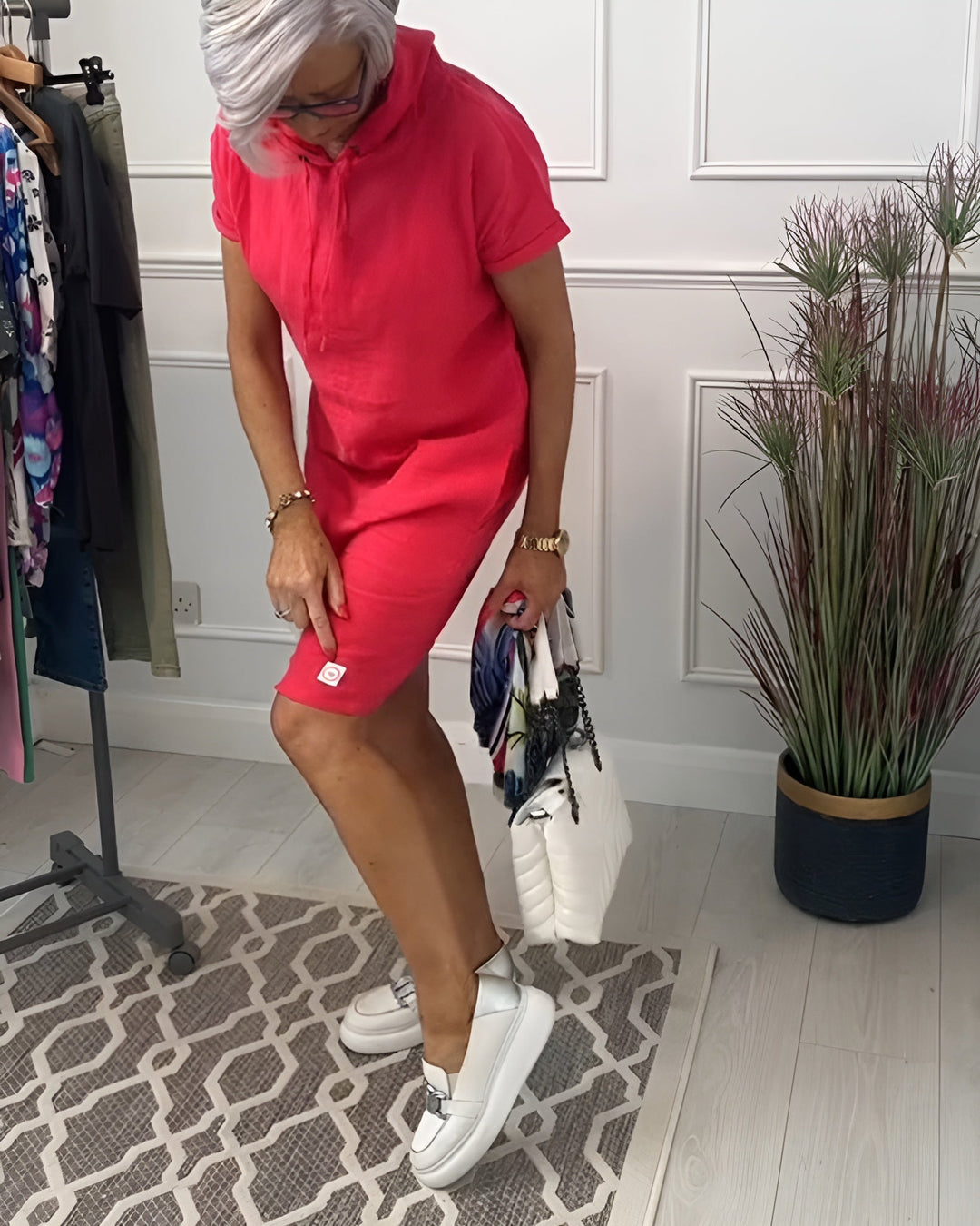 Casual women's midi dress featuring an adjustable hood and relaxed, comfortable fit.